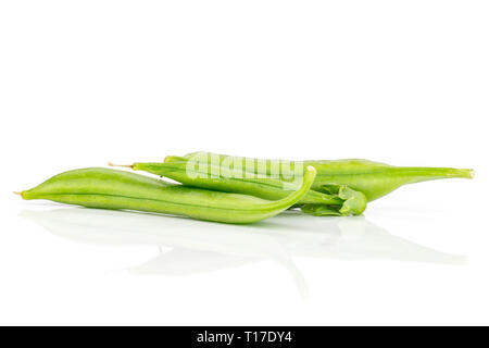 Group of three whole fresh green sugar snap pea isolated on white background Stock Photo