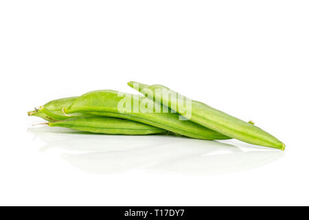 Group of three whole green sugar snap pea isolated on white background Stock Photo