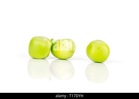 Closeup of three whole green sugar snap pea isolated on white background Stock Photo