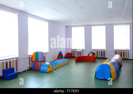 Interior of the physical therapy (rehabilitation) room for Down syndrome children: toys and rehabilitation equipment. February 12, 2019. Kiev, Ukraine Stock Photo