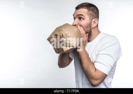 Man suffering from a stress attack. He is trying to come calm down. Isolated on white background. Stock Photo