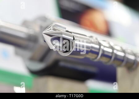 Screw press parts for plastic injection machine ; selective focus Stock Photo