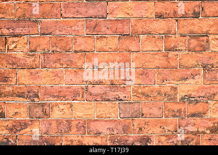 Background from an old and rugged orange brick wall Stock Photo