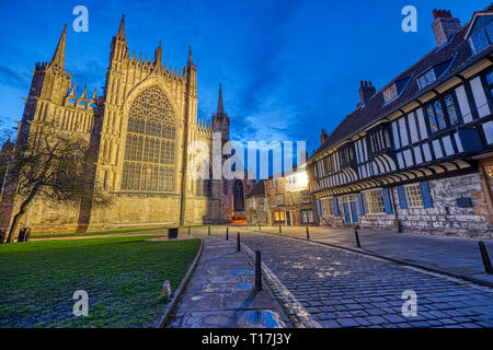 The backside of the York Minster and some half-timbered houses at dusk