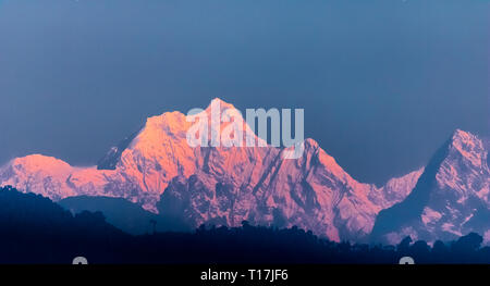 Kangchenjunga, also spelled Kanchenjunga, is the third highest mountain in the world. It lies between Nepal and Sikkim, India, with three of the five  Stock Photo