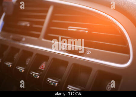 Car conditioner. The air flow inside the car. Detail interior. Air ducts, deflectors on the car panel. Stock Photo