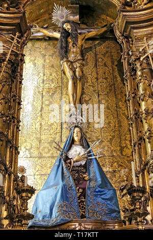 Porto, Portugal - March 4, 2015: Side altar of Santo Antonio dos Congregados church dedicated to Our Lady of Sorrows and the Passion and Death of Chri Stock Photo