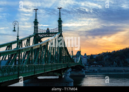Liberty bridge at sunset in Budapest, Hungary Stock Photo