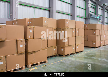 Rows of material boxes or product boxes in warehouse area. Stock Photo