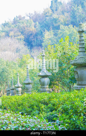 Hangzhou, Zhejiang, China - December 16 2018  : Stone lantern statues at Lingyin Temple Forest Park (Temple of the Soul's Retreat) One of the largest  Stock Photo