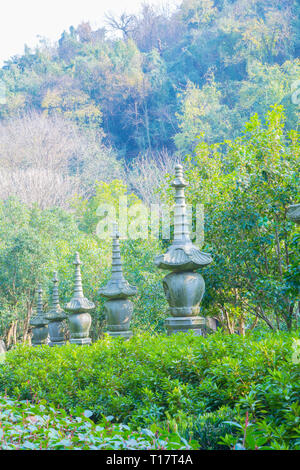 Hangzhou, Zhejiang, China - December 16 2018  : Stone lantern statues at Lingyin Temple Forest Park (Temple of the Soul's Retreat) One of the largest  Stock Photo