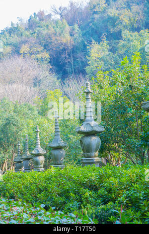 Hangzhou, Zhejiang, China - December 16 2018  : Stone lantern statues at Lingyin Temple Forest Park (Temple of the Soul's Retreat) One of the largest  Stock Photo