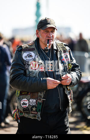 Brighton, UK. 24th March 2019. Visitors enjoy the 80th Anniversary Pioneer Run for pre 2015 veteran motorcycles in Brighton . The run organised by the Sunbeam Motor Cycle Club begins on the Epsom Downs in Surrey and finishes on Madeira Drive on Brighton seafront Credit: Simon Dack/Alamy Live News Stock Photo