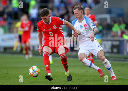 Cardiff, UK. 24th Mar, 2019.  Chris Mepham of Wales and Ondrej Duda of Slovakia challenge for the ball during the 2020 UEFA Euro Qualifier group E match between Wales and Slovakia at  the Cardiff City Stadium, Cardiff, Wales on 24 March 2019. Photo by Ken Sparks.  Editorial use only, license required for commercial use. No use in betting, games or a single club/league/player publications. Credit: UK Sports Pics Ltd/Alamy Live News Stock Photo