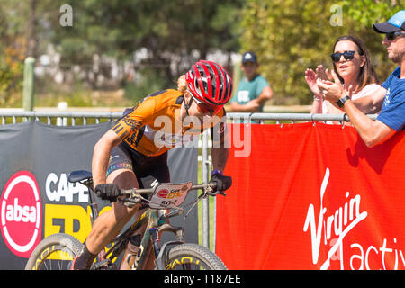 Paarl, South Africa.  24th March, 2019. Annika Langvad of Denmark and team Investec-songo-Specialized sprinting down the final home straight with a smile on her face, taking it all in her stride and looking like a true winner of one of the  toughest mountain bike races in the world. Credit: Childa Santrucek/Alamy Live News Stock Photo