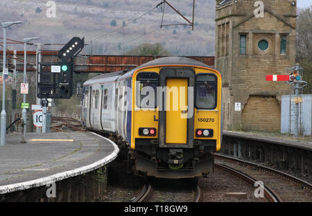 Class 150 sprinter diesel mutiple unit in Northern livery leaving Carnforth railway station with an ordinary passenger service on 21st March 2019. Stock Photo