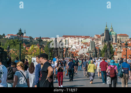 Prague, Czech Republic - September 10, 2019: Charles bridge crowded with tourists during the day Stock Photo