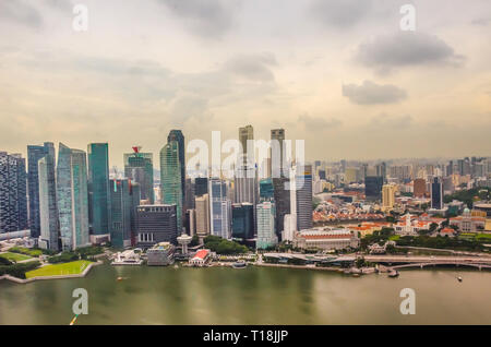 Singapore, Southeast Asia - December 15, 2018: Vibrant panorama of Downtown from observation deck of the Marina Bay Sands Sky Park. Marina Bay. Stock Photo