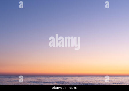 Colorful sky after sunset. Sunset on the background of the sea. Blue hour. Stock Photo