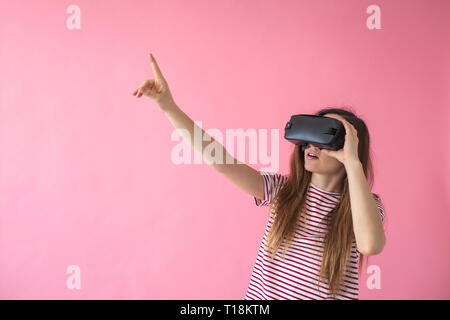 The woman with glasses of virtual reality. Future technology concept. Modern imaging technology. Stock Photo