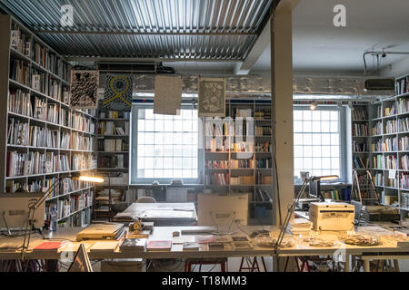 Prague, Czech Republic - September 10, 2019: spacious office full of books at DOX, Prague Gallery of contemporary art Stock Photo