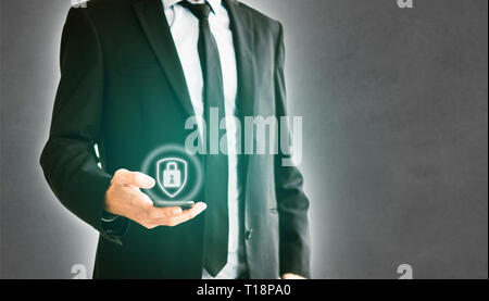 cyber security concept man holding mobile phone, businessman using smartphone Stock Photo