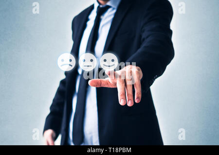 costumer review concept, man pointing on happy smiling face Stock Photo