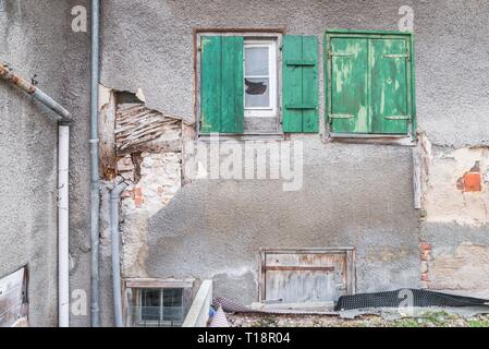 Old window with closed wooden shutters, Germany Stock Photo