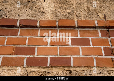 brick wall embedded in a house wall Stock Photo
