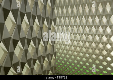 Geometric wall pattern with green background lights Stock Photo