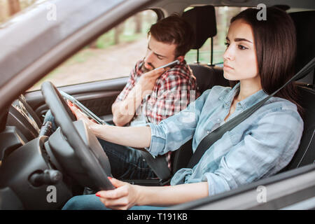 Inside car with cell phone on driver with coffee and camera bag for travel  in holidays Stock Photo - Alamy