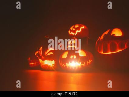 Ghost pumpkins on Halloween. ead Jack on Dark background. Holiday indoor decorations. Stock Photo