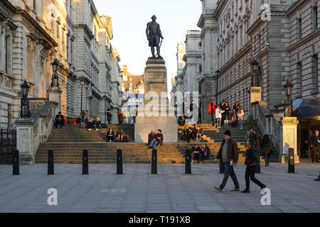 People enjoying sunset on Clive Steps with Robert Clive Memorial in the middle, London England United Kingdom UK Stock Photo
