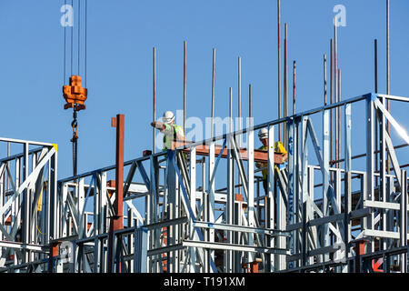 Builders working on construction site of residential building at Stratford, London England United Kingdom UK Stock Photo