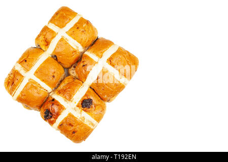 Four freshly baked hot cross buns isolated on a pure white background Stock Photo