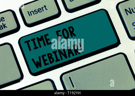 Text sign showing Time For Webinar. Business photo text seminar conducted over the Internet Web conferencing Keyboard key Intention to create computer Stock Photo