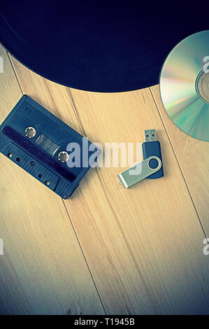 Vintage Look Music Recording Evolution with Cassette USB Key, Vinyl record and CD Stock Photo