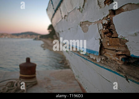 Rusty old boat with paint peeling and cracked hull Stock Photo