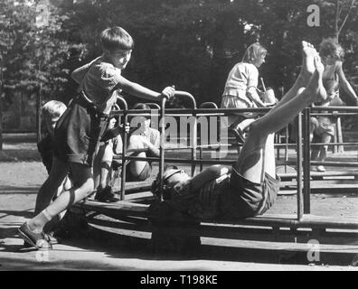 people, children, playing, children on playground during summer holidays, Duesseldorf, 1960s, Additional-Rights-Clearance-Info-Not-Available Stock Photo