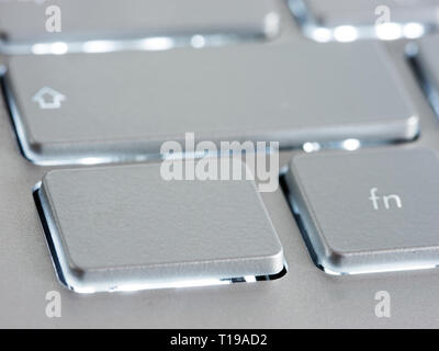 Blank silver button on laptop keyboard. Empty key button with copy space for message. Extreme close up Stock Photo