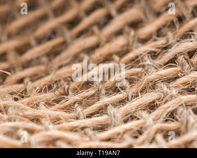 Skein of jute twine on sacking. Clew of natural rope. Close up Stock Photo