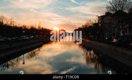 Sunset sun in Bucharest by the Dambovita river Stock Photo