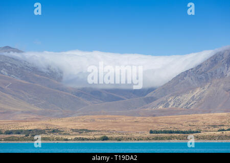 Cloud formation over mountains, Lake Tekapo, New Zealand Stock Photo