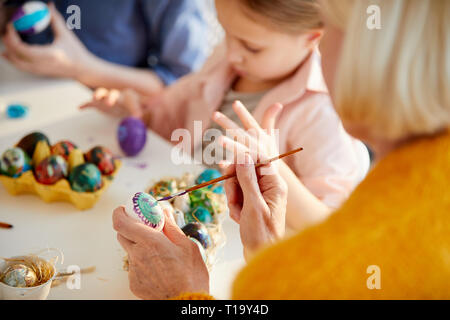 Woman Painting Easter Eggs Stock Photo