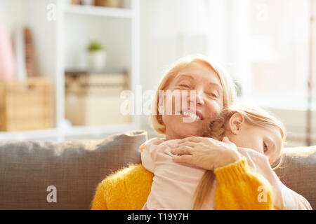 Caring Mother Embracing Child Stock Photo