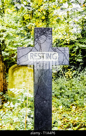 black cross gravestone Stock Photo - Alamy