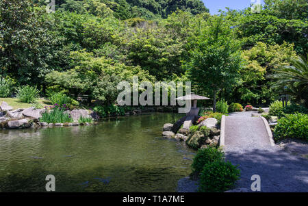 Japanese Garden covered by green Landscape. Taken in the wonderful Sengan-en Garden. Located in Kagoshima, Kyushu, South of Japan. Stock Photo