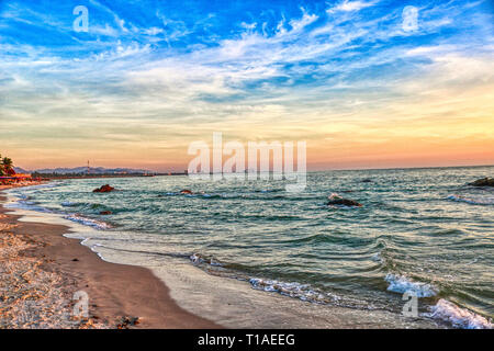 This great photo shows the beach of Hua HIn in Thailand early morning at sunrise. You can see very well the coast of the gulf of Thailand Stock Photo