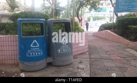 Garbage sorting bins are placed in streets or parks to facilitate people to put garbage. Stock Photo
