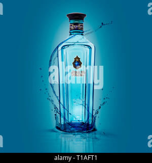 SWINDON, UK - MARCH 24, 2019: Star Of Bombay London Dry Gin with splashes on a blue background Stock Photo